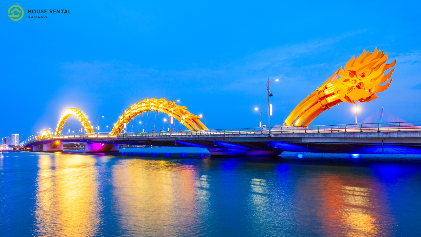 A dragon statue on a bridge in Da Nang, ensuring safety at night.