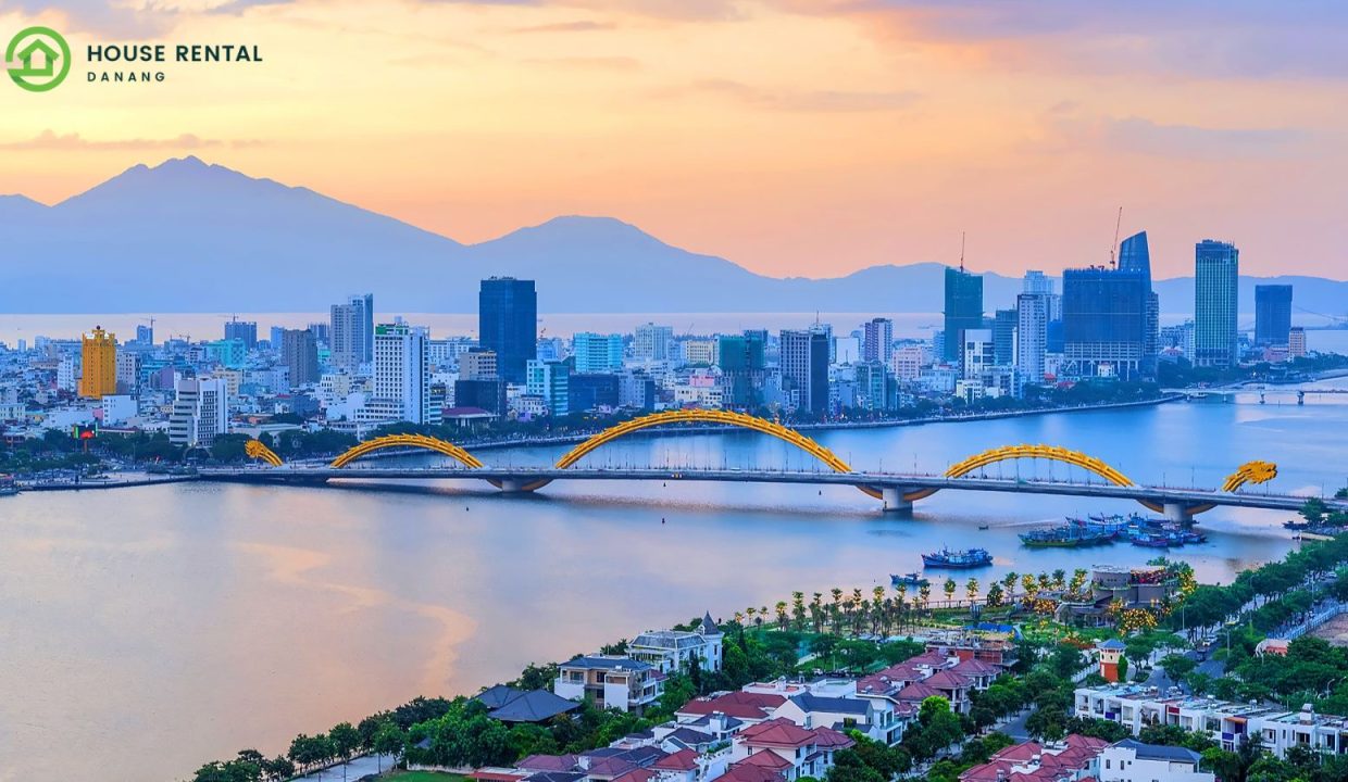 A city with a bridge and mountains in the background, featuring Danang and Singapore.