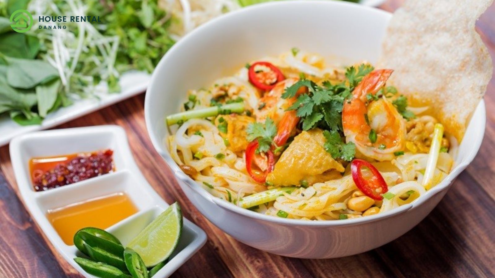 Visiting Danang from Singapore: A bowl of noodle soup with shrimp and vegetables.