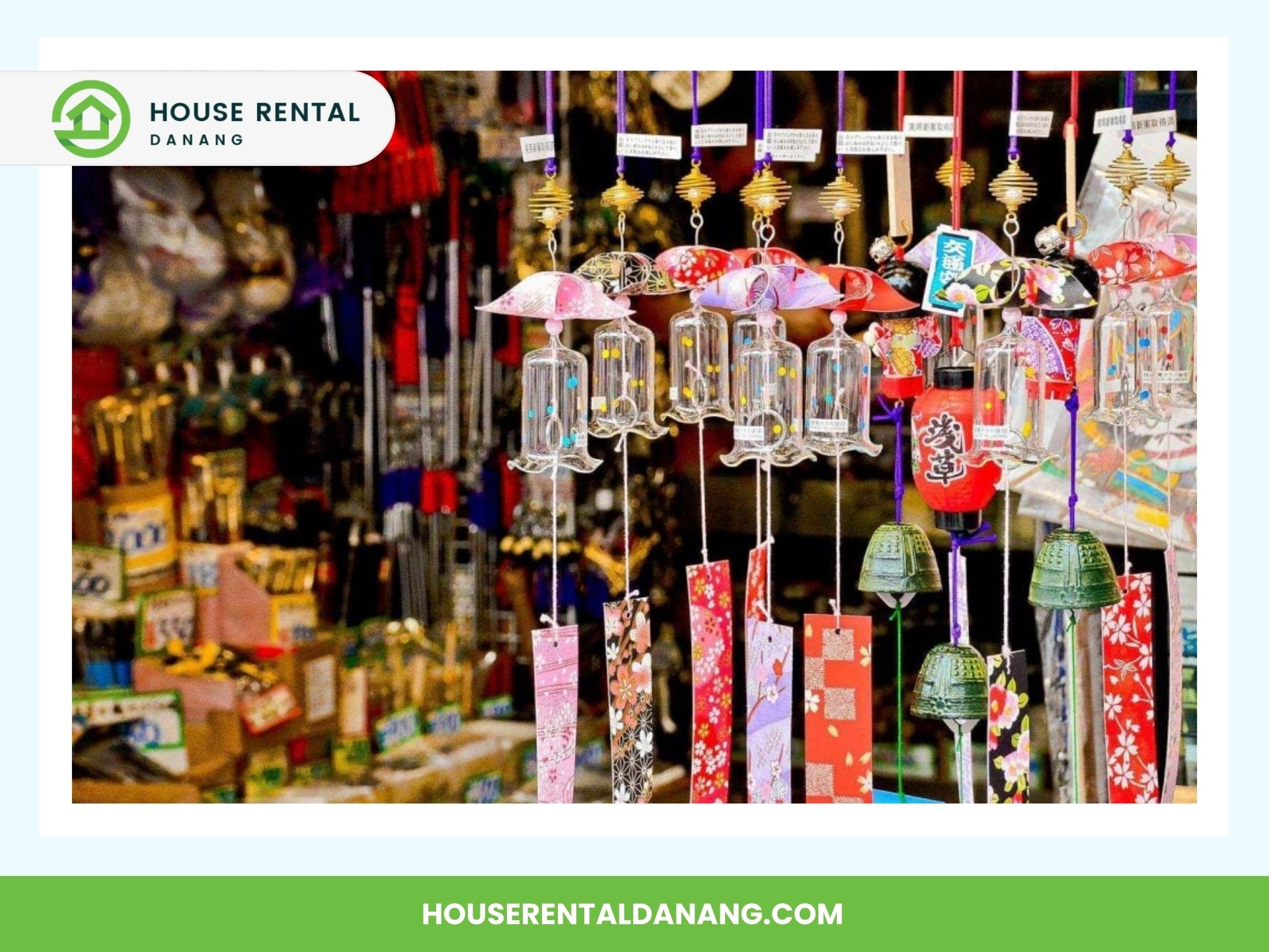 A variety of traditional Japanese wind chimes are displayed in a shop. They come in different colors and shapes, including bells and origami designs. This charming spot is among the best places for shopping in Da Nang, offering a unique array of items in the background.