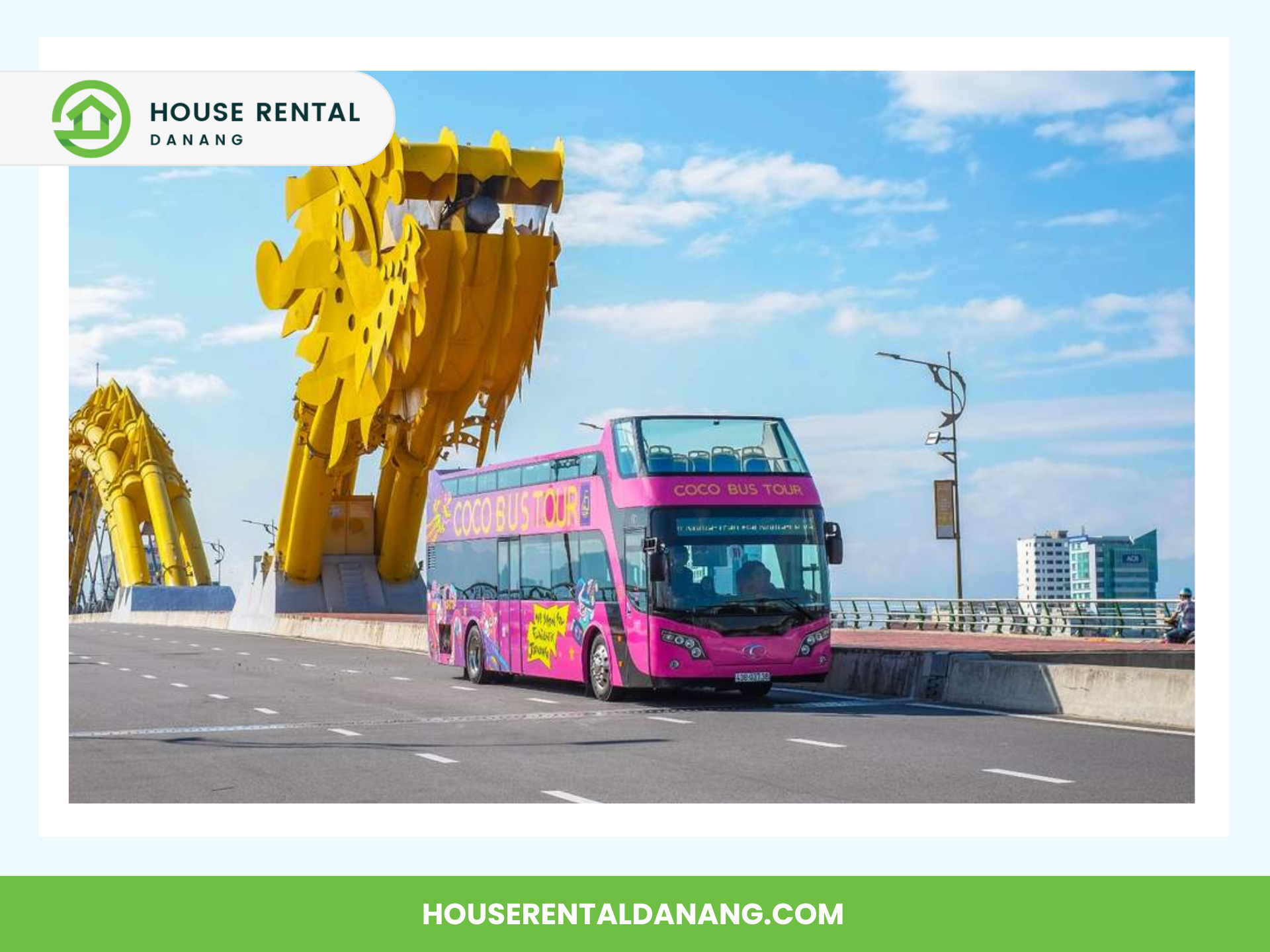 A double-decker tour bus drives across the Dragon Bridge in Da Nang, with a large dragon sculpture overhead in Vietnam.