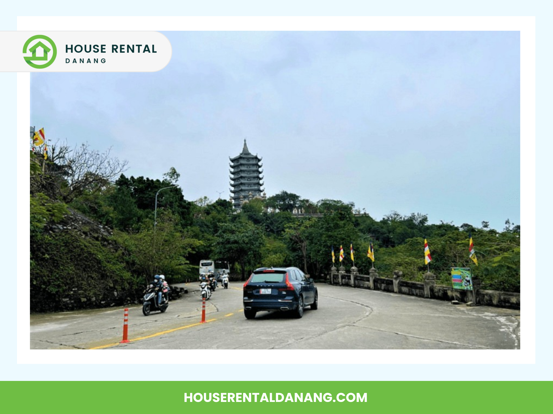 Cars and motorcycles travel along a road leading to Linh Ung Pagoda atop a hill, surrounded by greenery. Several flags are displayed along the roadside. The image is framed with a banner for "House Rental Danang.