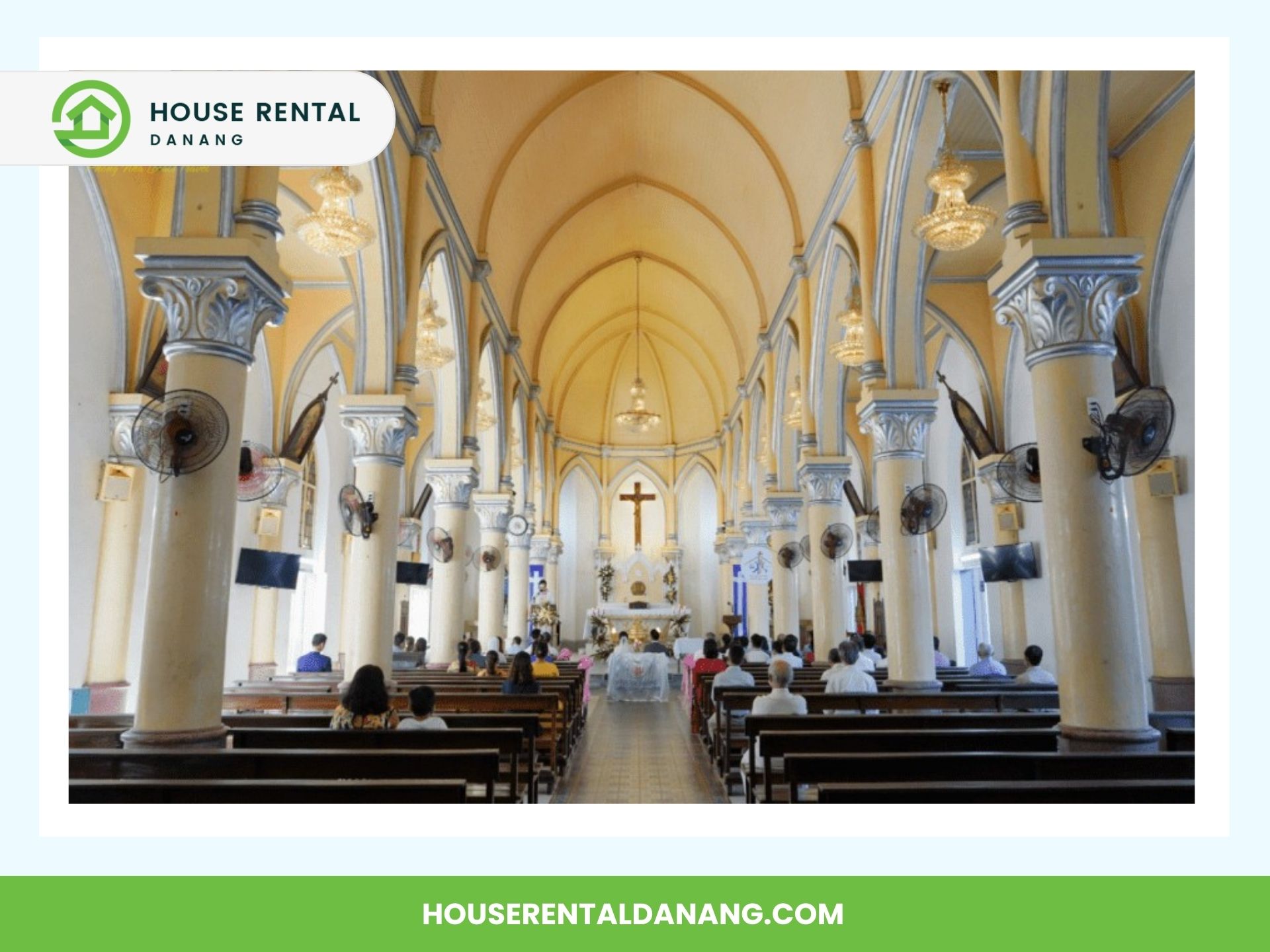 Interior view of Da Nang Cathedral with people seated in pews facing the altar, featuring arched columns and a high ceiling.