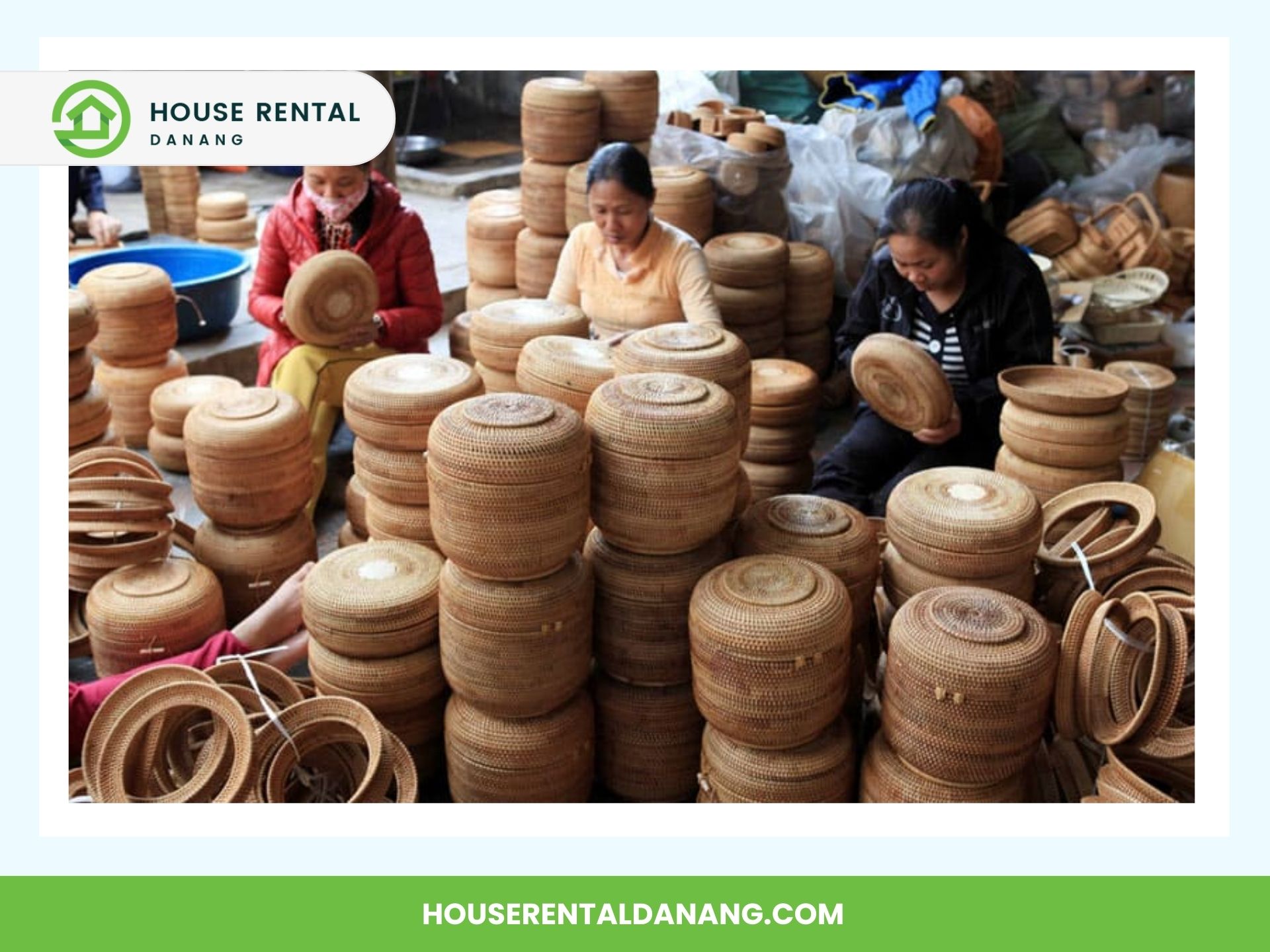 Workers assembling and stacking woven baskets surrounded by stacks of completed baskets. A "House Rental Danang" logo is in the top left-hand corner, and the website address is at the bottom. Experience authentic craftsmanship in Da Nang, a vibrant coastal city with treasures like Han Market.